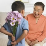 Grandson Giving Grandmother Flowers