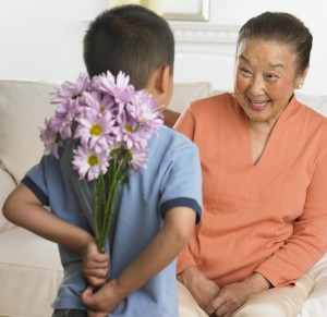 Grandson Giving Grandmother Flowers